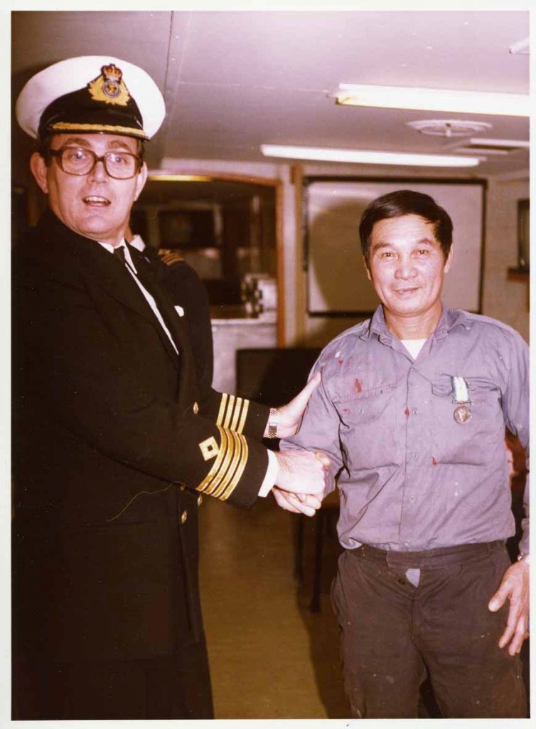 Capt Philip Roberts
Presenting medal.
