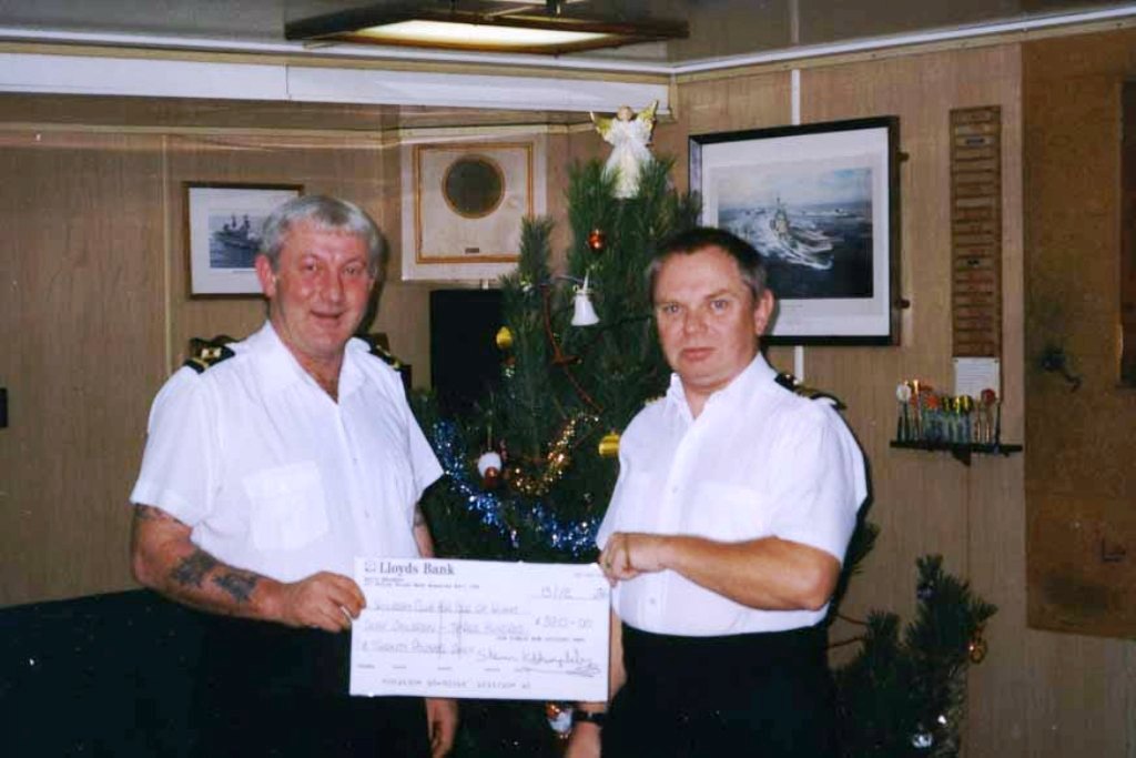 RFA RESOURCE
At Split, Croatia, Christmas 1996.
3/O(L) Jerry Ralph presents cheque for Â£320 in aid of IOW Saturday Club for Deaf Children to 1/O (L) Bob Roullier.
